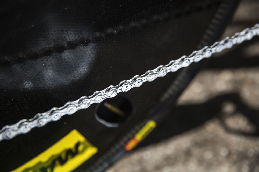 Waxing a bike chain sale